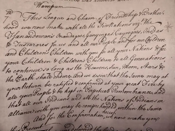 Handwritten treaty manuscript in dark cursive ink on aged paper